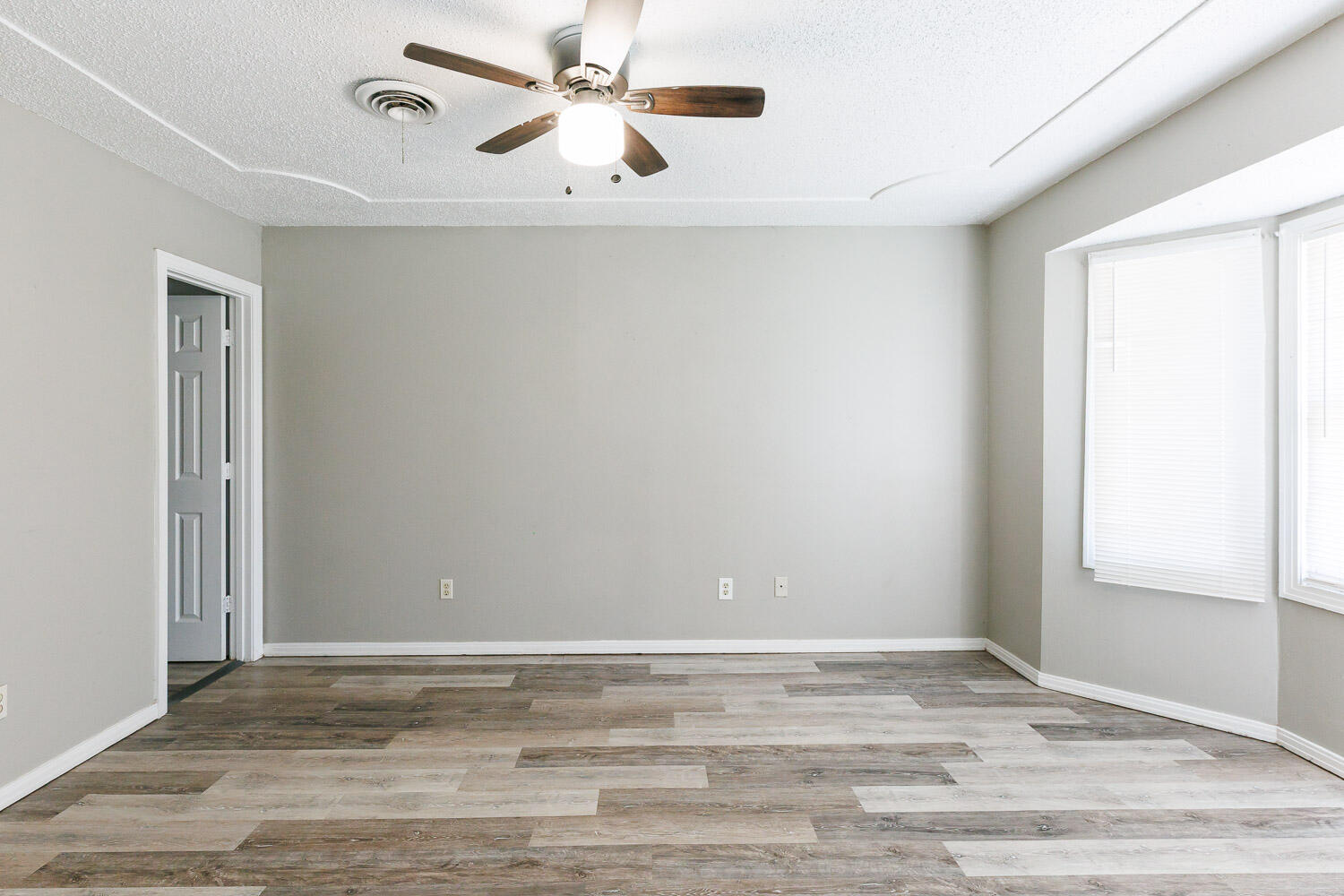 2417 37th Street Lubbock, TX 79412 - Photo 18 of 35 a view of a livingroom with a ceiling fan and window