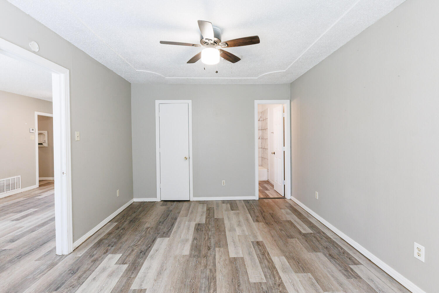 2417 37th Street Lubbock, TX 79412 - Photo 19 of 35 wooden floor in an empty room with a window