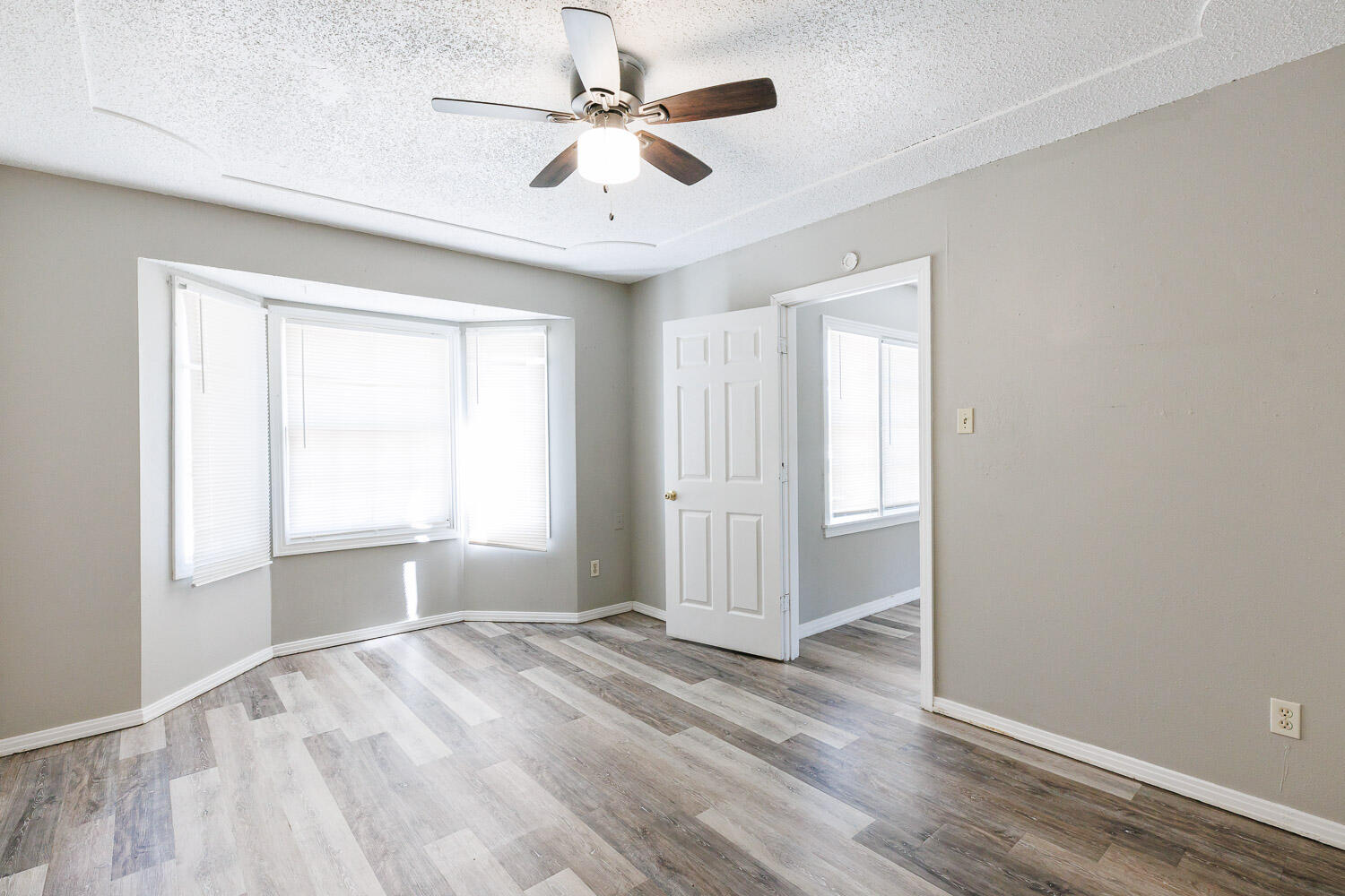 2417 37th Street Lubbock, TX 79412 - Photo 20 of 35 wooden floor in an empty room with a window