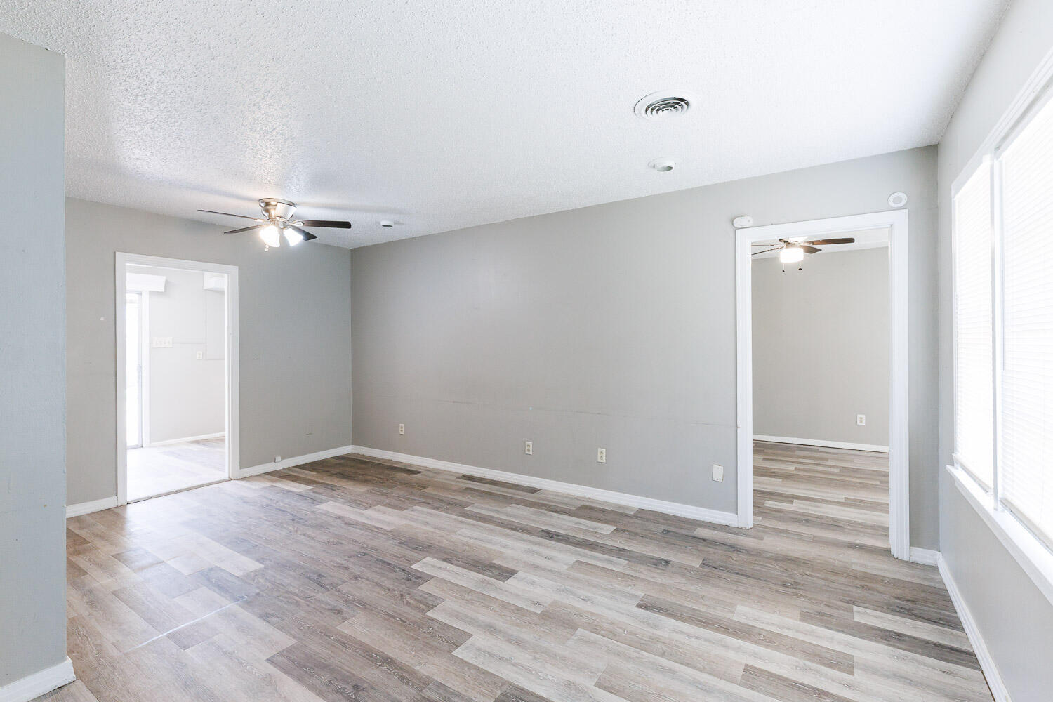 2417 37th Street Lubbock, TX 79412 - Photo 2 of 35 a view of an empty room with wooden floor