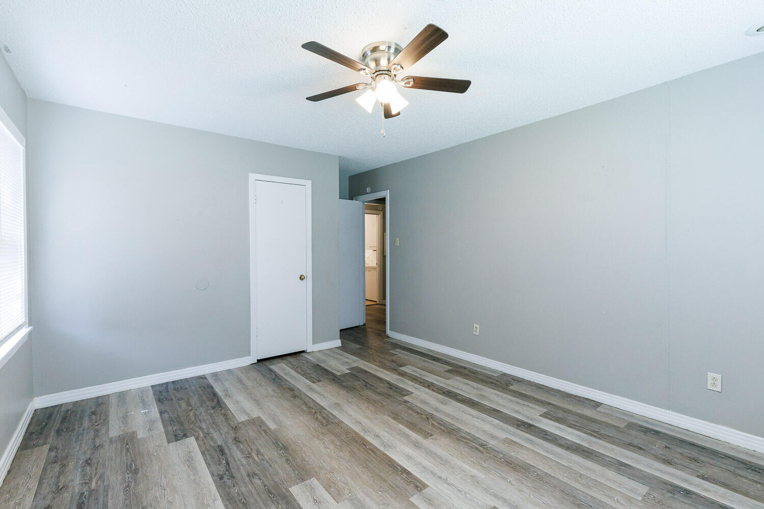 2417 37th Street Lubbock, TX 79412 - Photo 23 of 35 wooden floor in an empty room