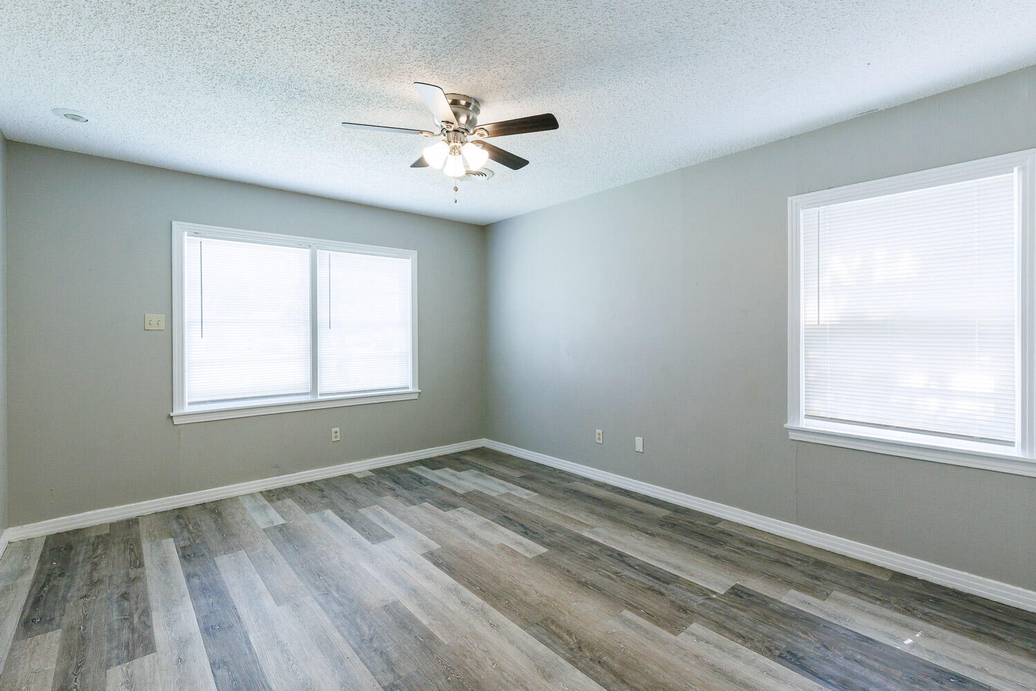 2417 37th Street Lubbock, TX 79412 - Photo 24 of 35 a view of wooden floor and windows in a room