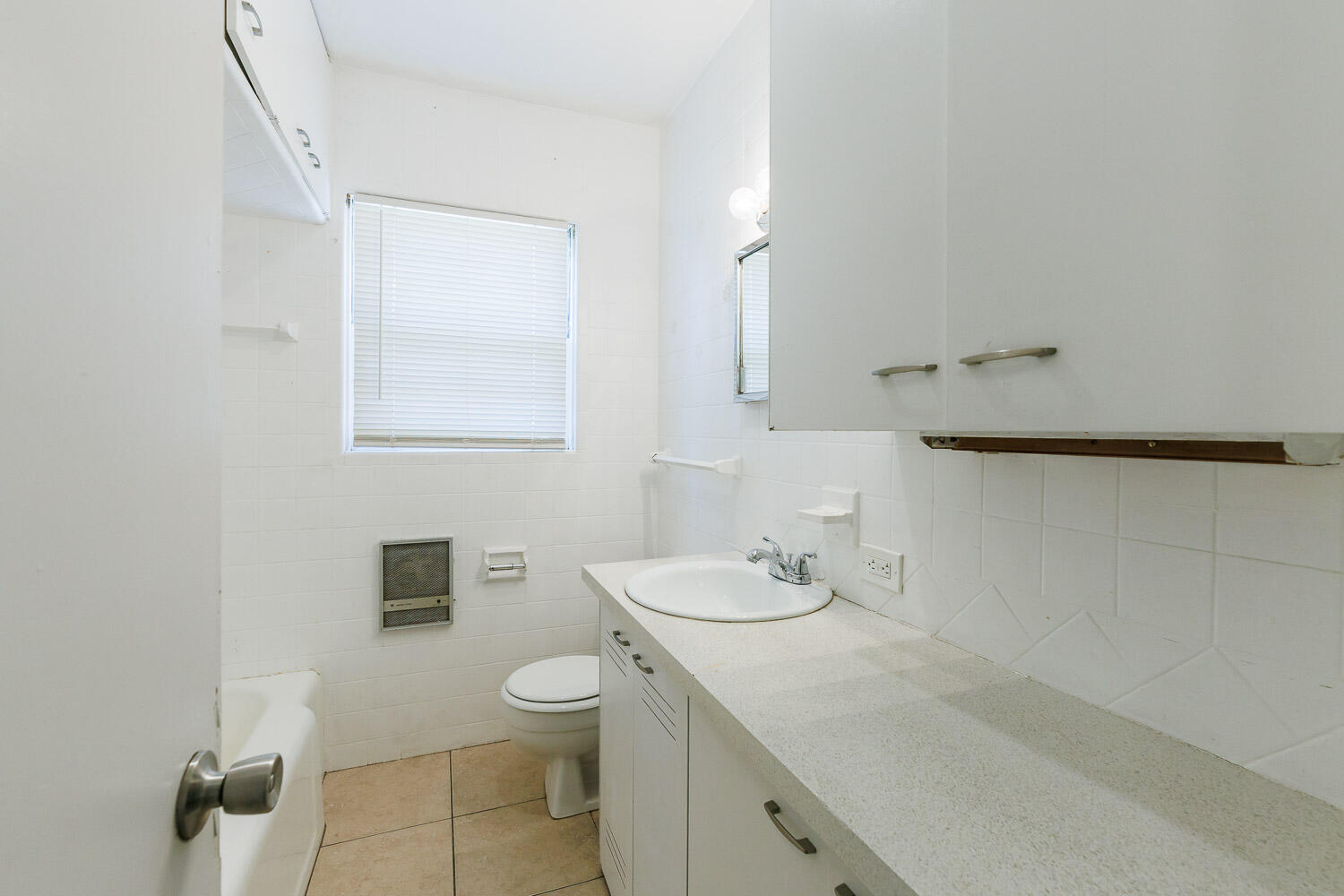 2417 37th Street Lubbock, TX 79412 - Photo 25 of 35 a bathroom with a granite countertop sink a toilet and a mirror