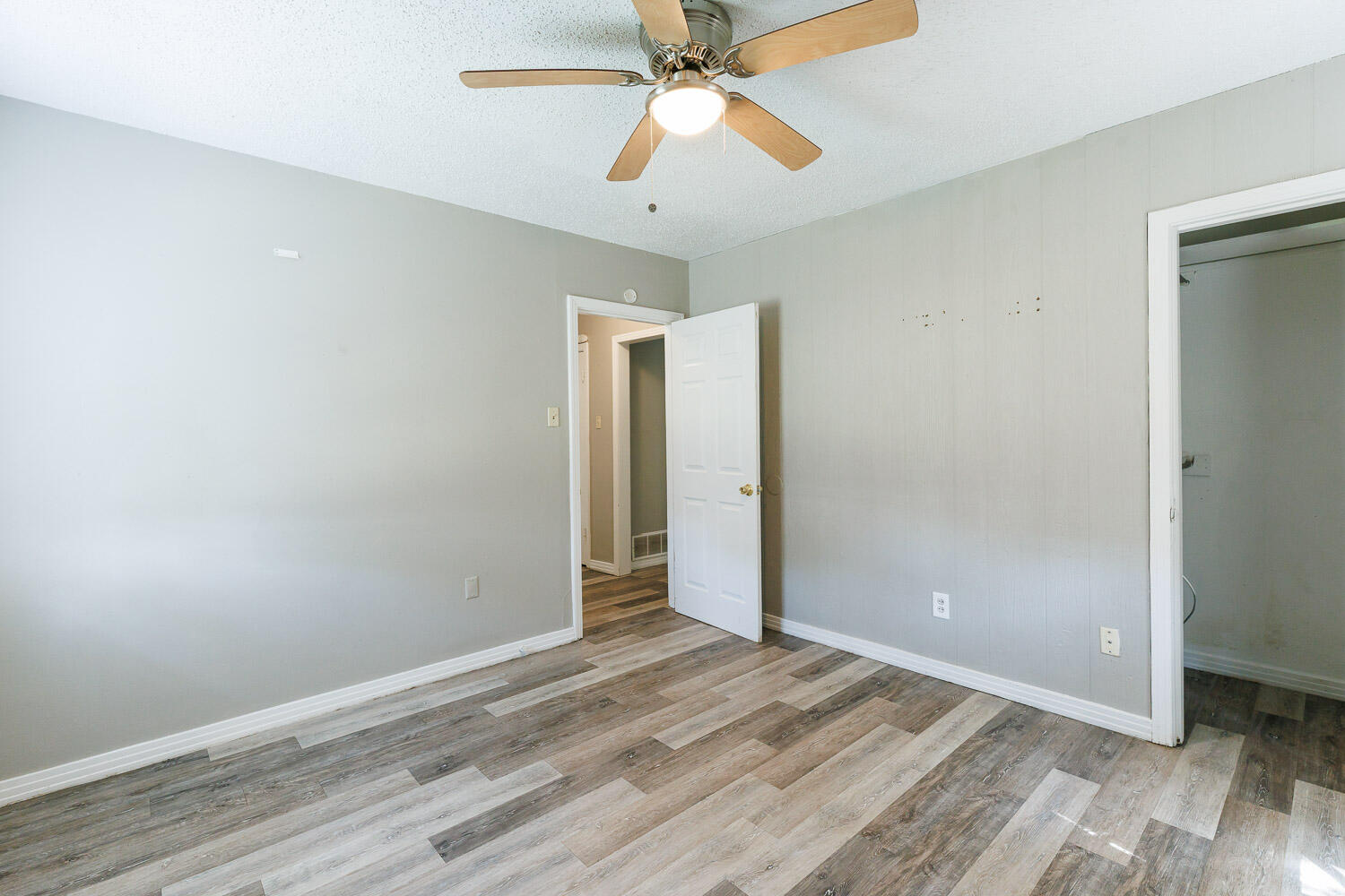 2417 37th Street Lubbock, TX 79412 - Photo 29 of 35 wooden floor in an empty room