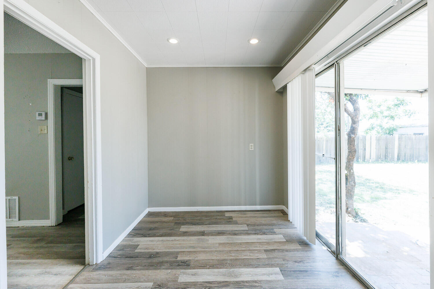 2417 37th Street Lubbock, TX 79412 - Photo 3 of 35 a view of empty room with wooden floor and fan
