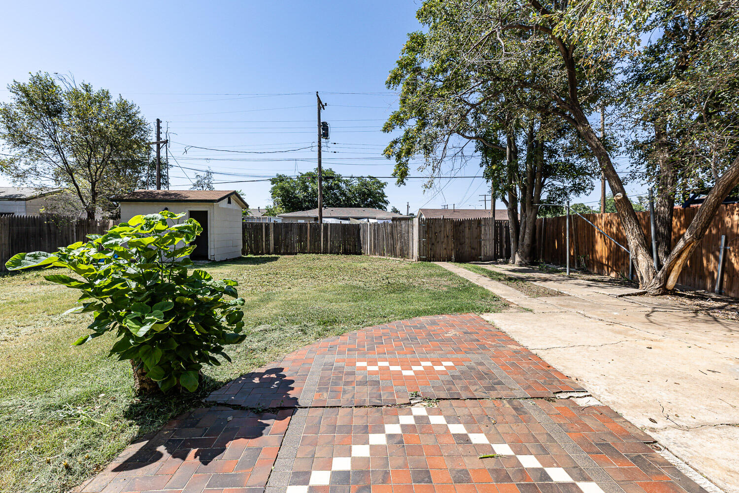 2417 37th Street Lubbock, TX 79412 - Photo 5 of 35 a house with trees in front of it