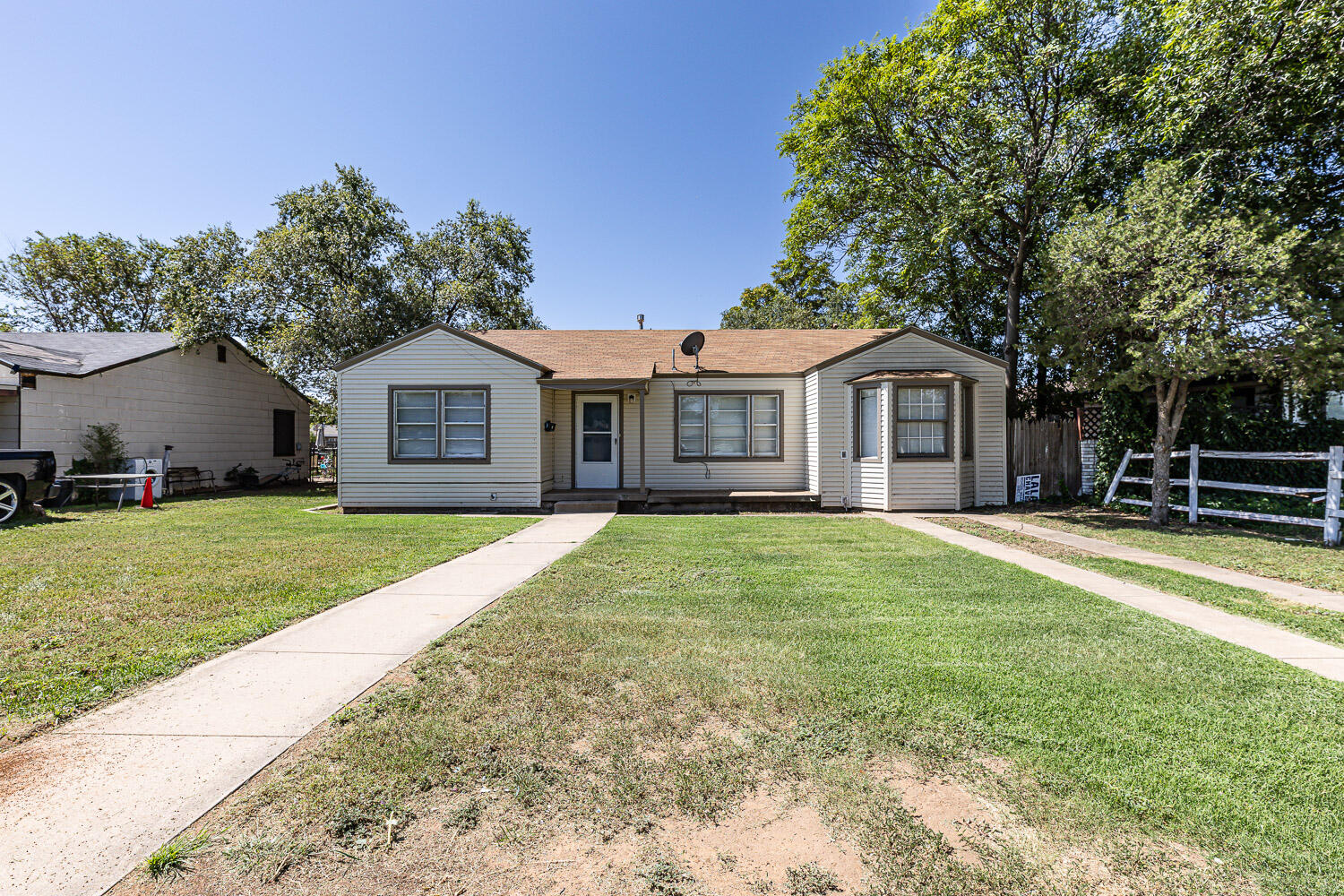2417 37th Street Lubbock, TX 79412 - Photo 6 of 35 a front view of a house with a garden