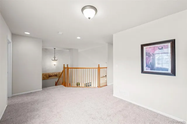 a view of an empty room with a cabinet