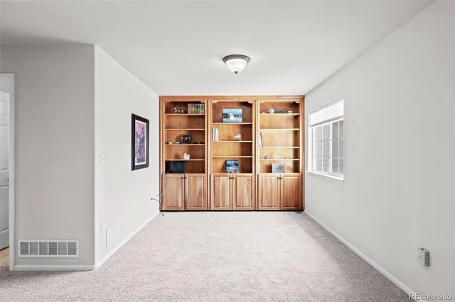 a living room with furniture and window