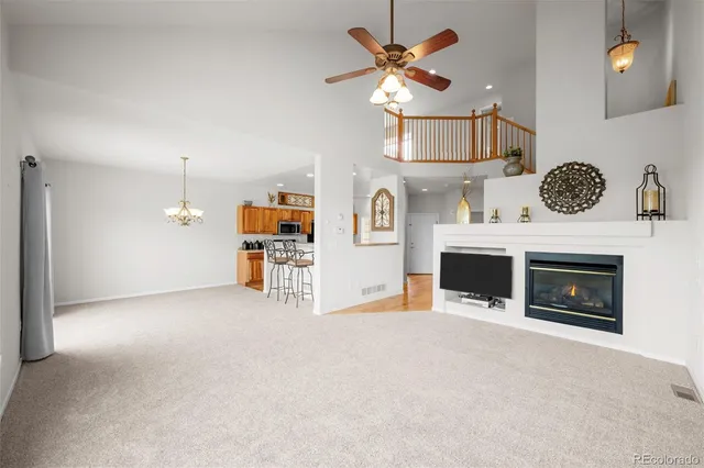 a view of a kitchen with furniture and a fireplace