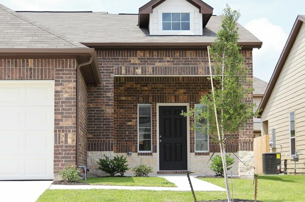 12243 Dona Lane Houston, TX 77044 - Photo 2 of 17 a front view of a house with a yard