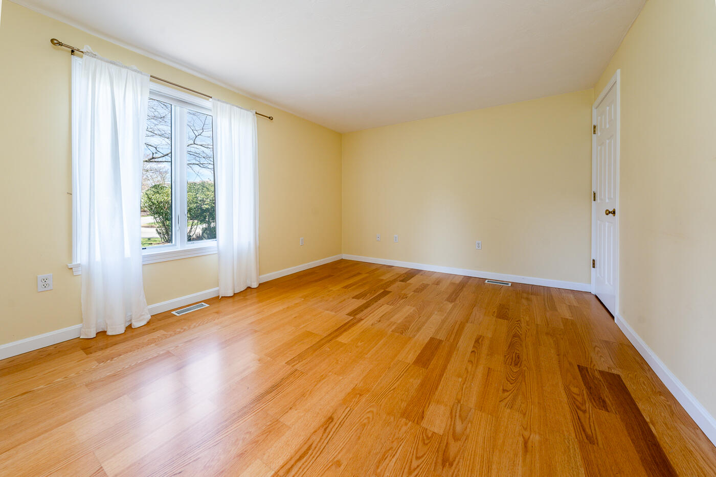 15 Beacon Court Mashpee, MA 02649 - Photo 13 of 33 a bedroom with a bed and wooden floor