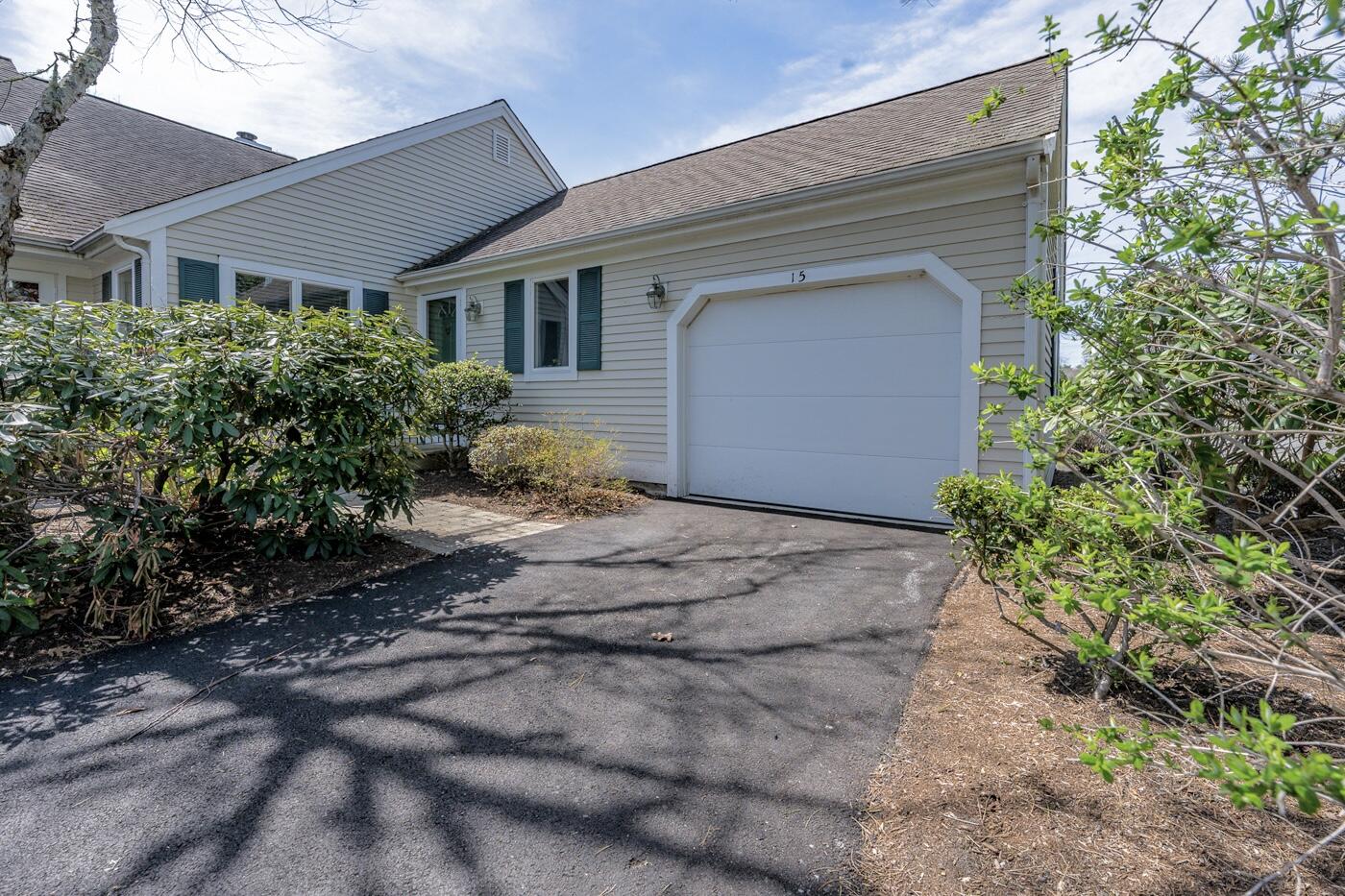 15 Beacon Court Mashpee, MA 02649 - Photo 20 of 33 a view of a house with a yard and plants
