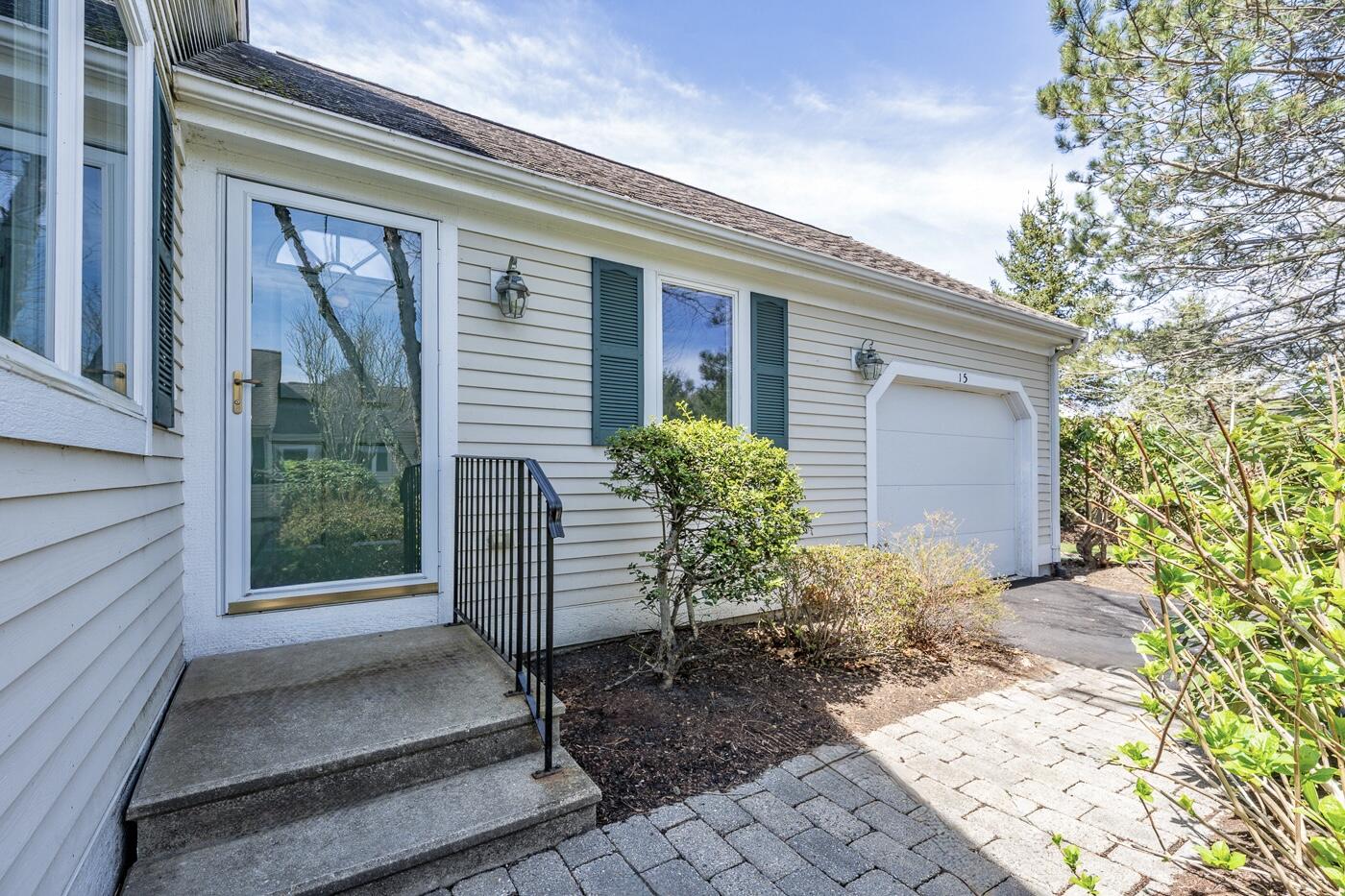 15 Beacon Court Mashpee, MA 02649 - Photo 2 of 33 a front view of a house with garden