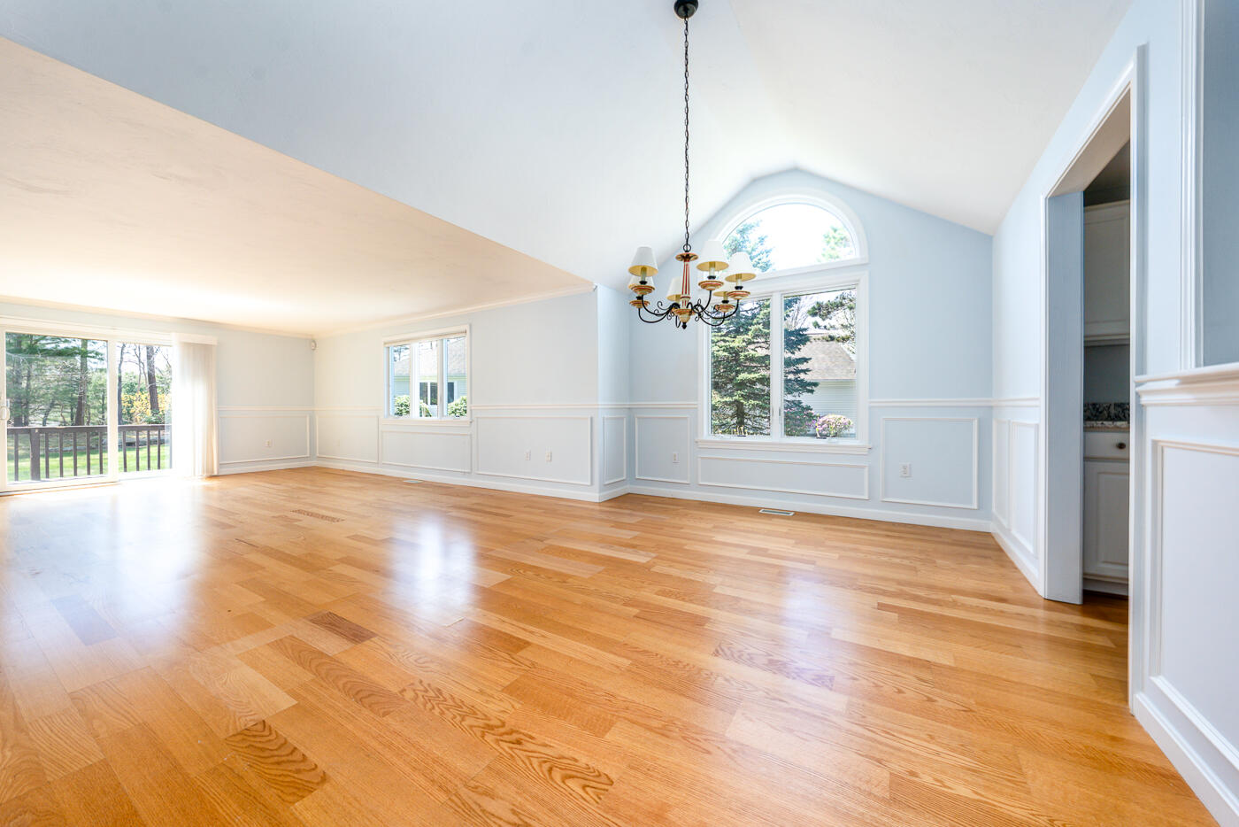 15 Beacon Court Mashpee, MA 02649 - Photo 3 of 33 a view of empty room with wooden floor and fan
