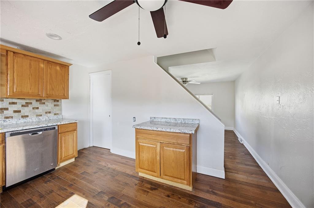 5 Rosamond Street McKees Rocks, PA 15136 - Photo 6 of 17 a kitchen with a refrigerator sink and cabinets