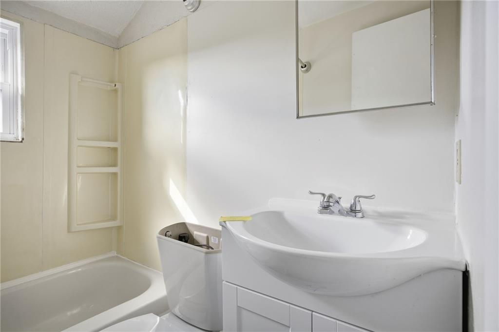 5 Rosamond Street McKees Rocks, PA 15136 - Photo 9 of 17 a bathroom with a sink a toilet and shower