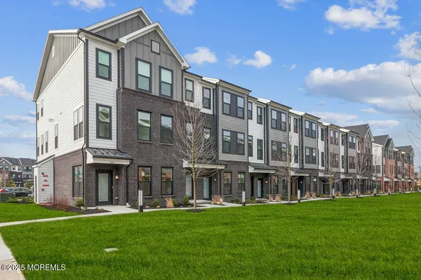 a large building with a yard in front of it