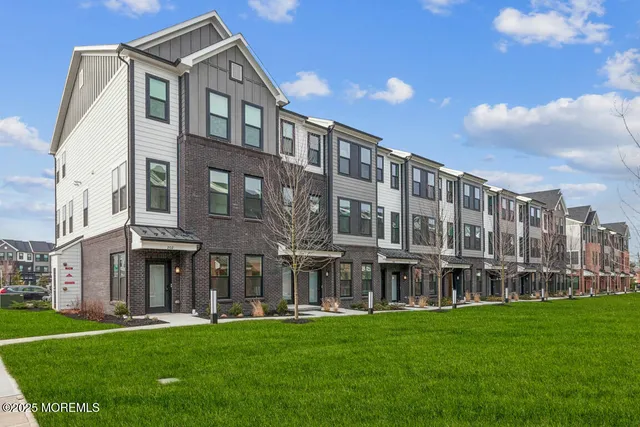 a large building with a yard in front of it