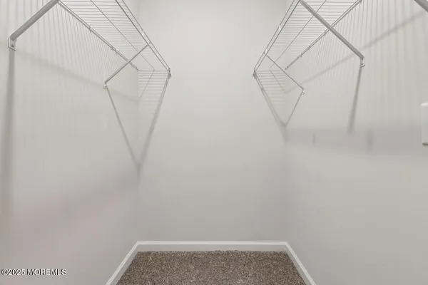 a view of small space with empty racks on the wall