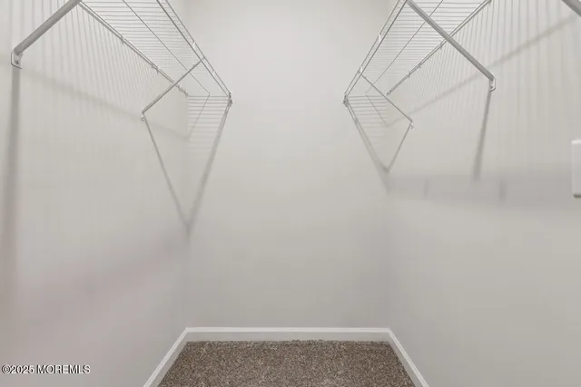 a view of small space with empty racks on the wall