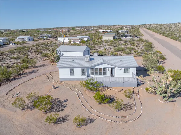an aerial view of residential houses with outdoor space