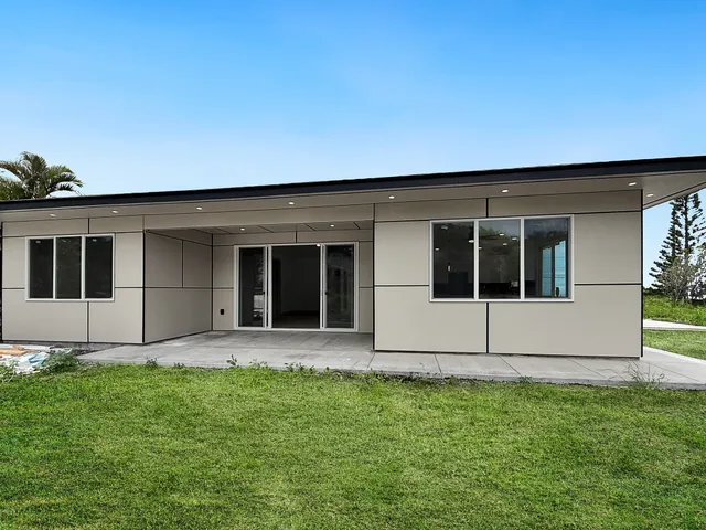 a view of house with yard