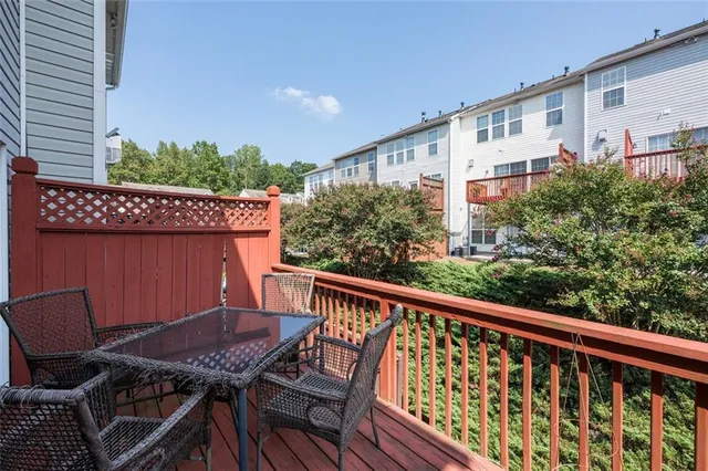 a view of a balcony with chairs