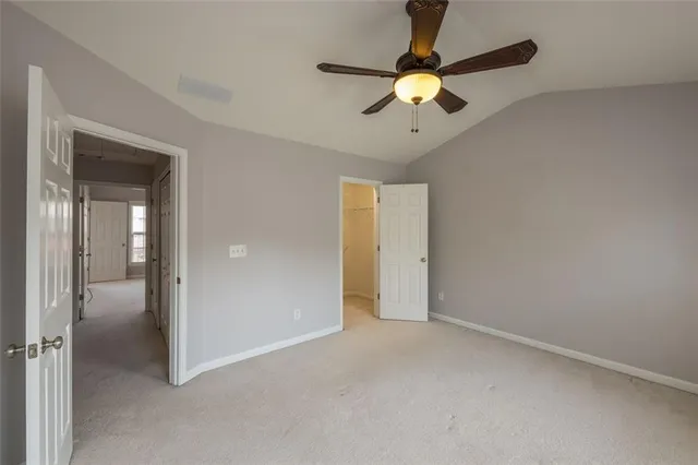 a bathroom with a sink toilet vanity and shower