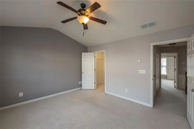 a bathroom with a double vanity sink toilet and shower