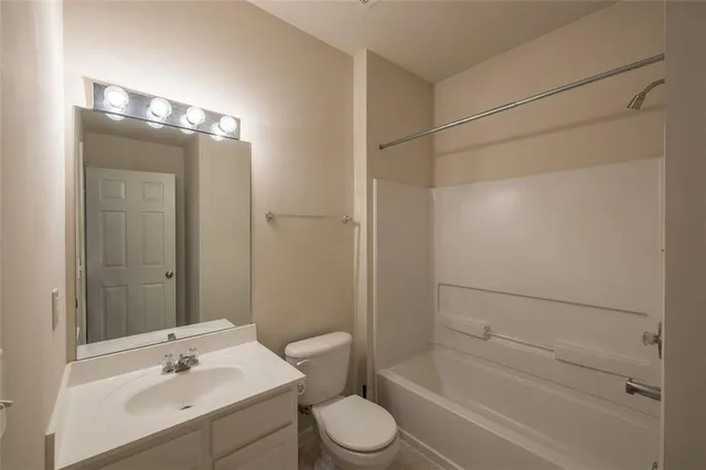 a view of a house with swimming pool and sitting area