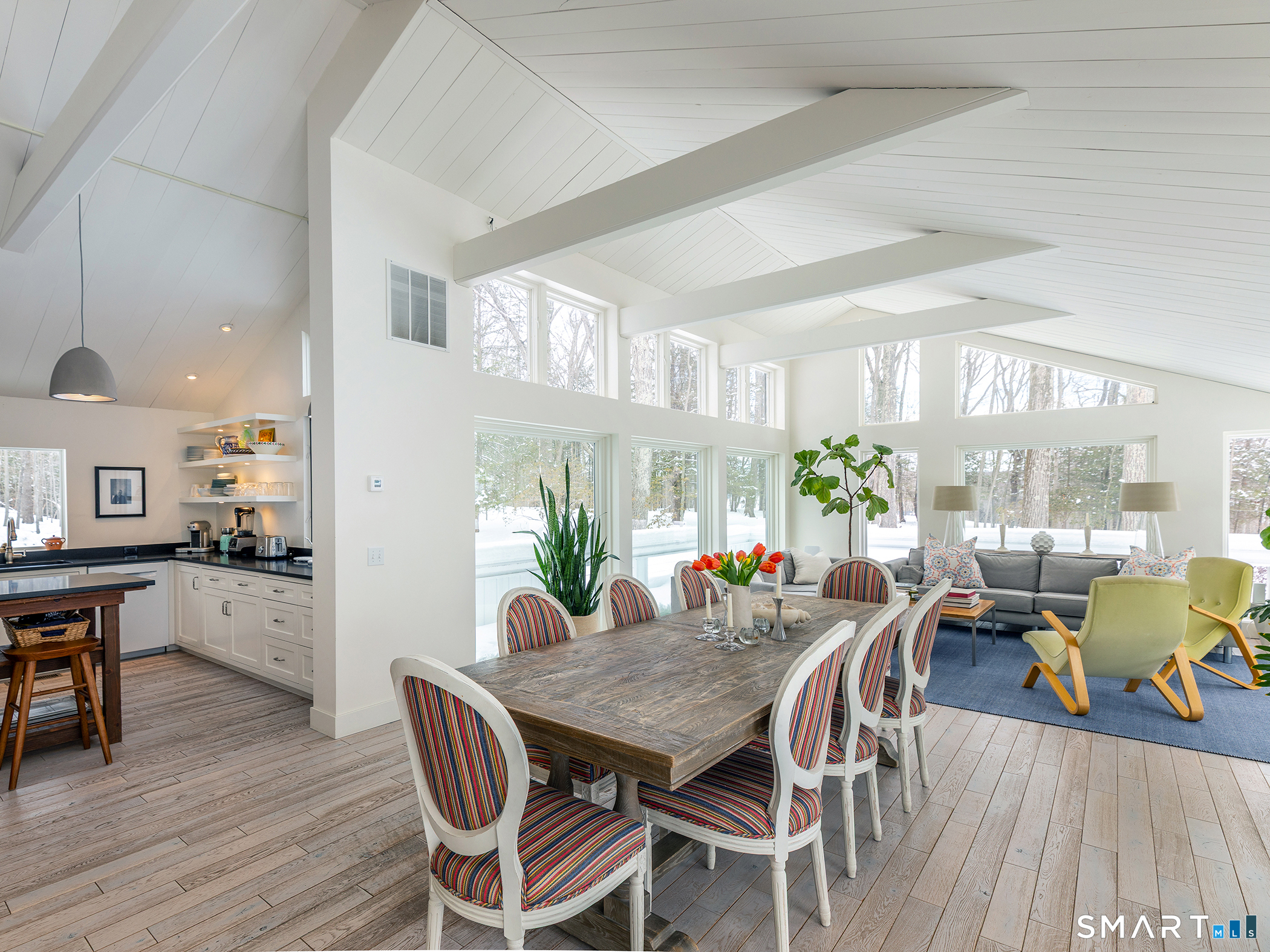 63 West Mountain Road Washington, CT 06793 - Photo 13 of 31 a view of a dining room with furniture and wooden floor