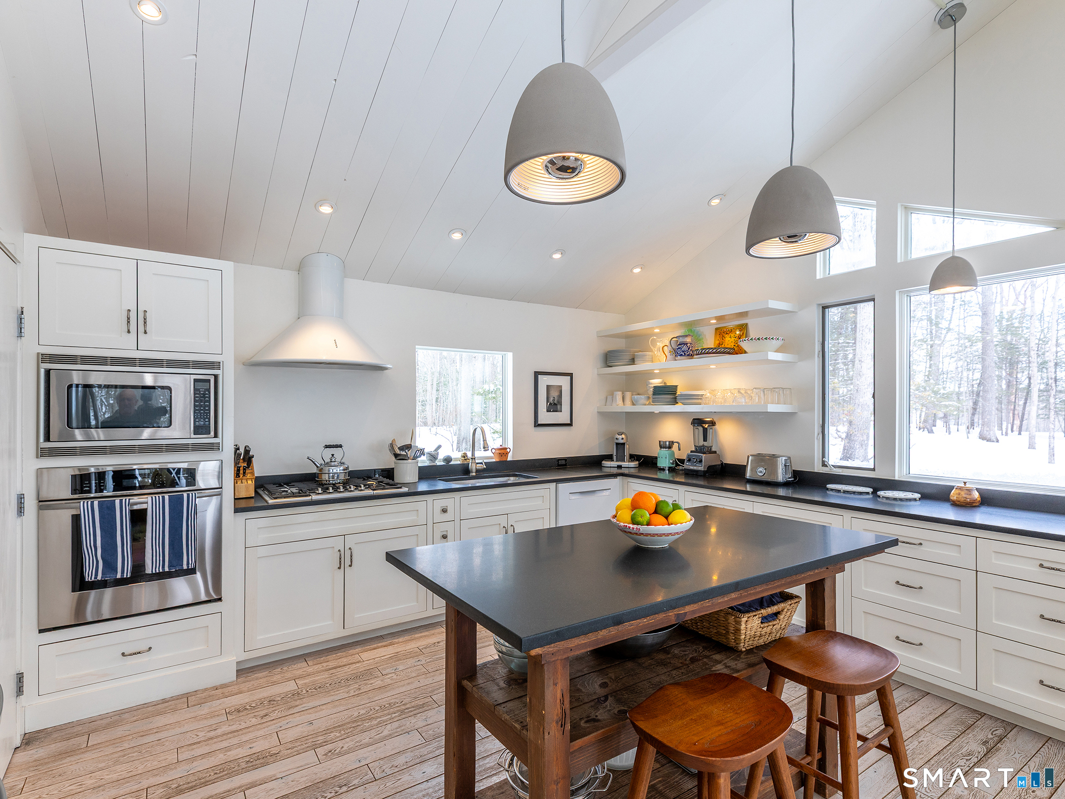63 West Mountain Road Washington, CT 06793 - Photo 17 of 31 a kitchen with a stove a window and chairs