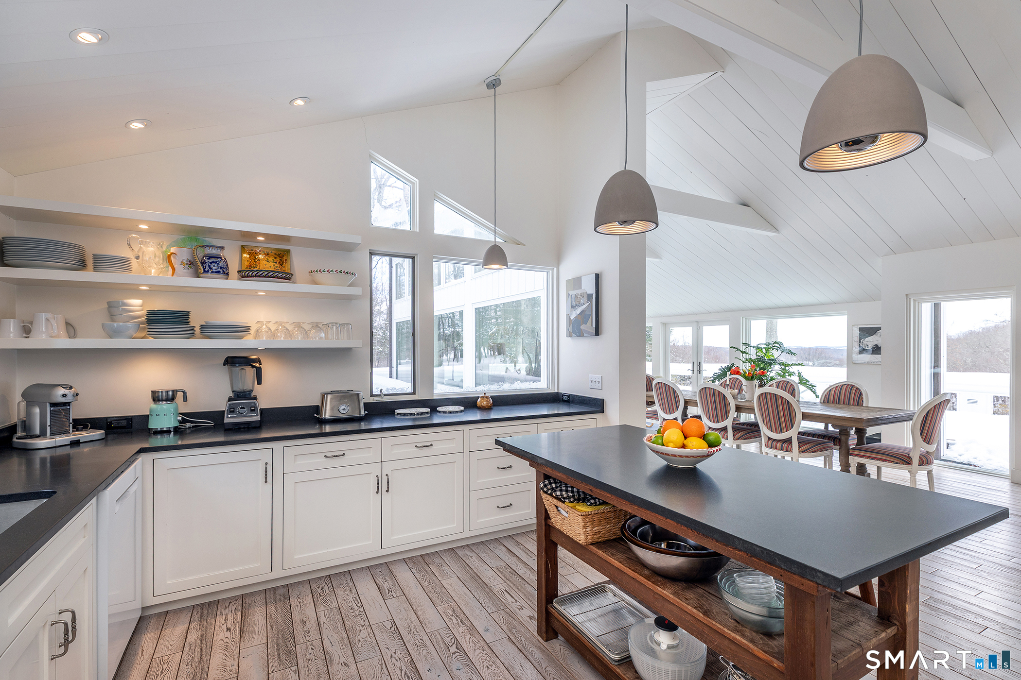63 West Mountain Road Washington, CT 06793 - Photo 19 of 31 a kitchen with a sink a stove and chairs