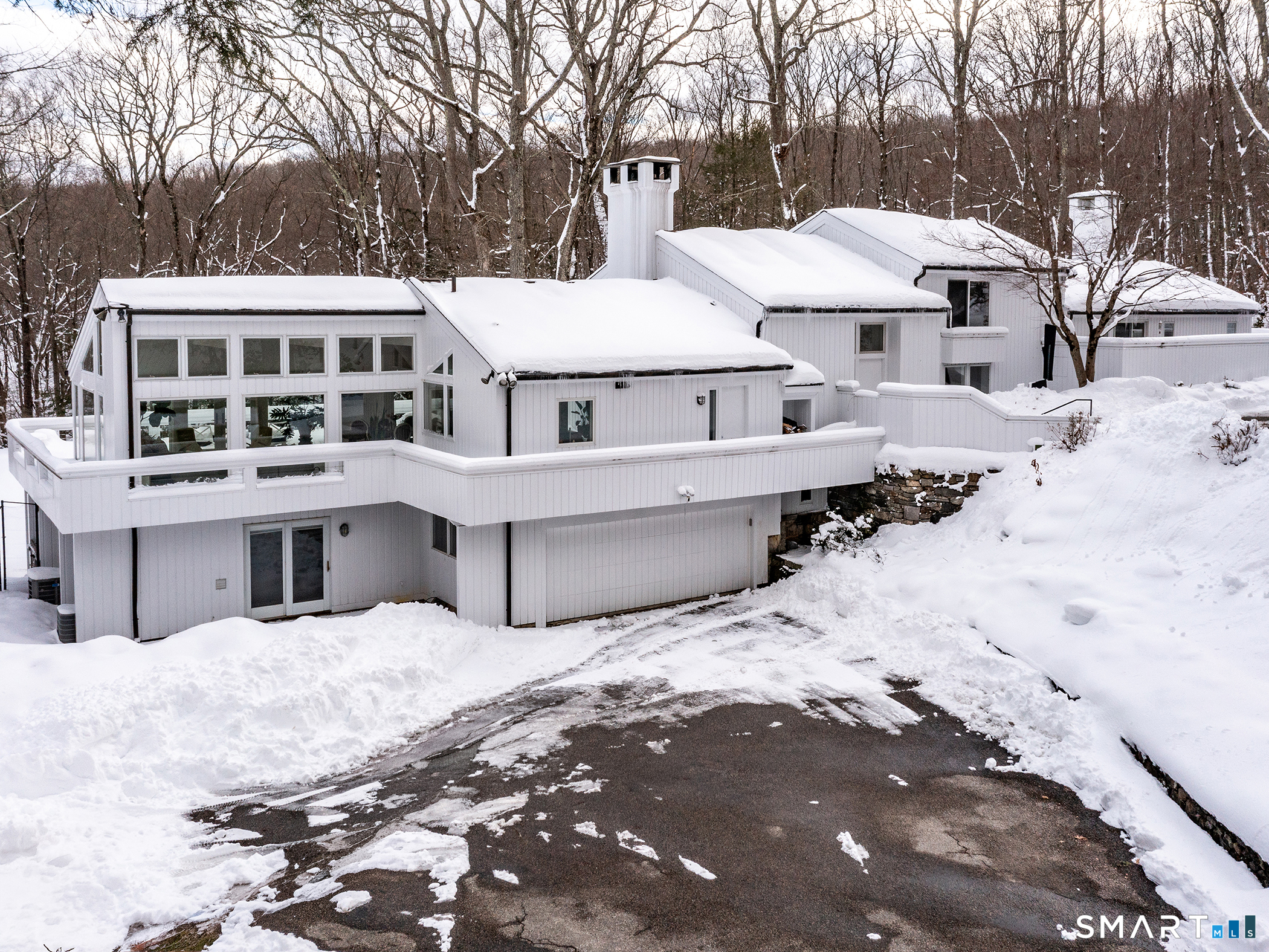 63 West Mountain Road Washington, CT 06793 - Photo 2 of 31 a view of a white house with a yard covered in snow