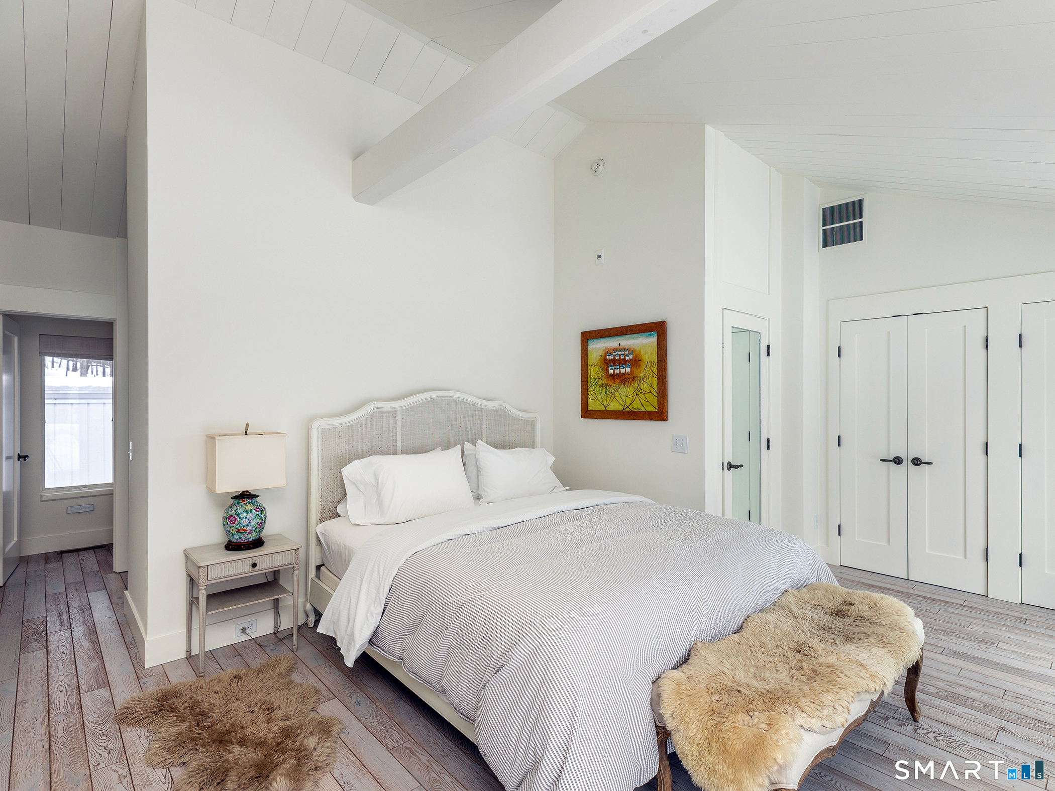 63 West Mountain Road Washington, CT 06793 - Photo 25 of 31 a bedroom with a bed and a lamp