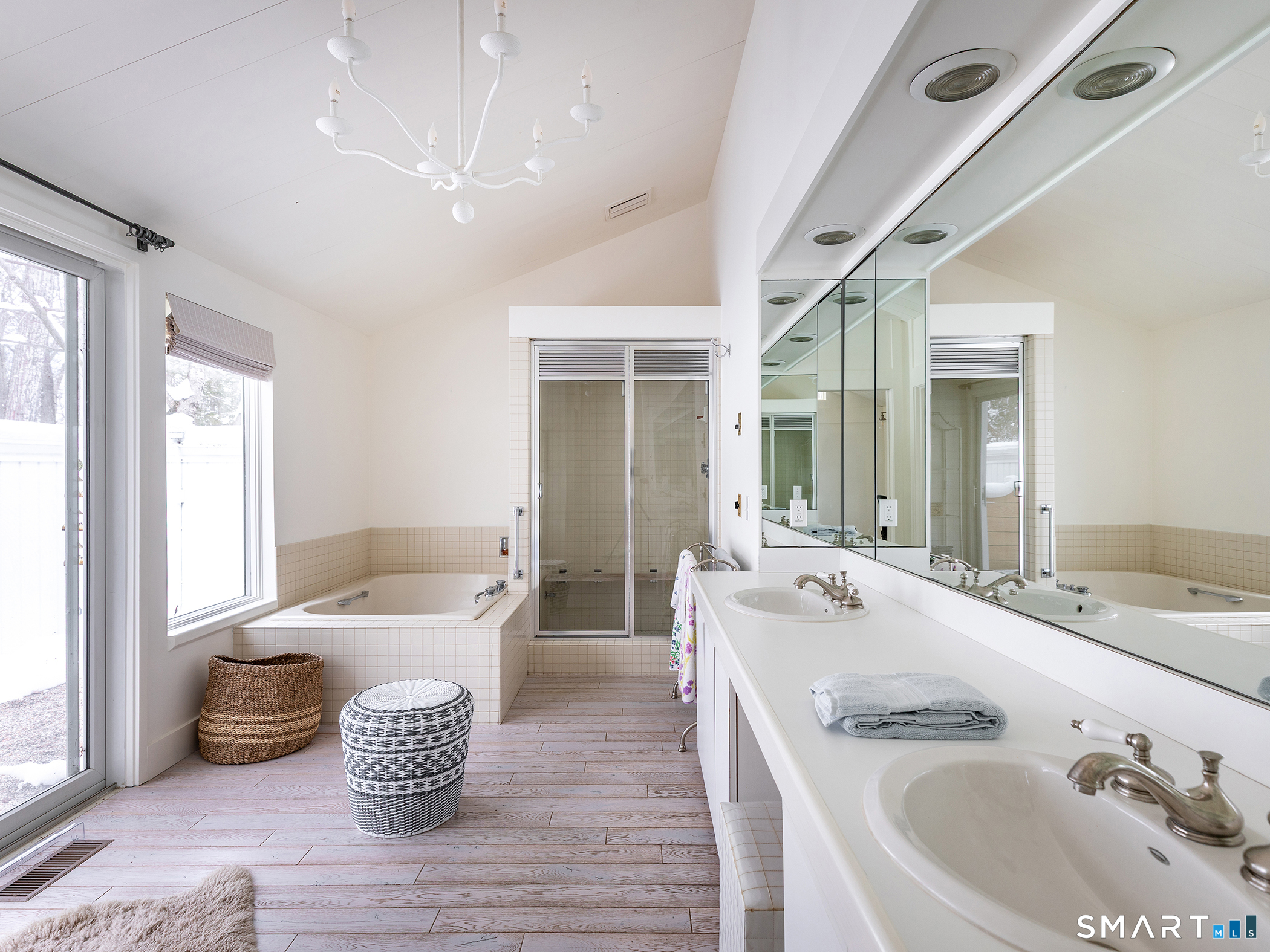 63 West Mountain Road Washington, CT 06793 - Photo 27 of 31 a spacious bathroom with a double vanity sink and a bathtub