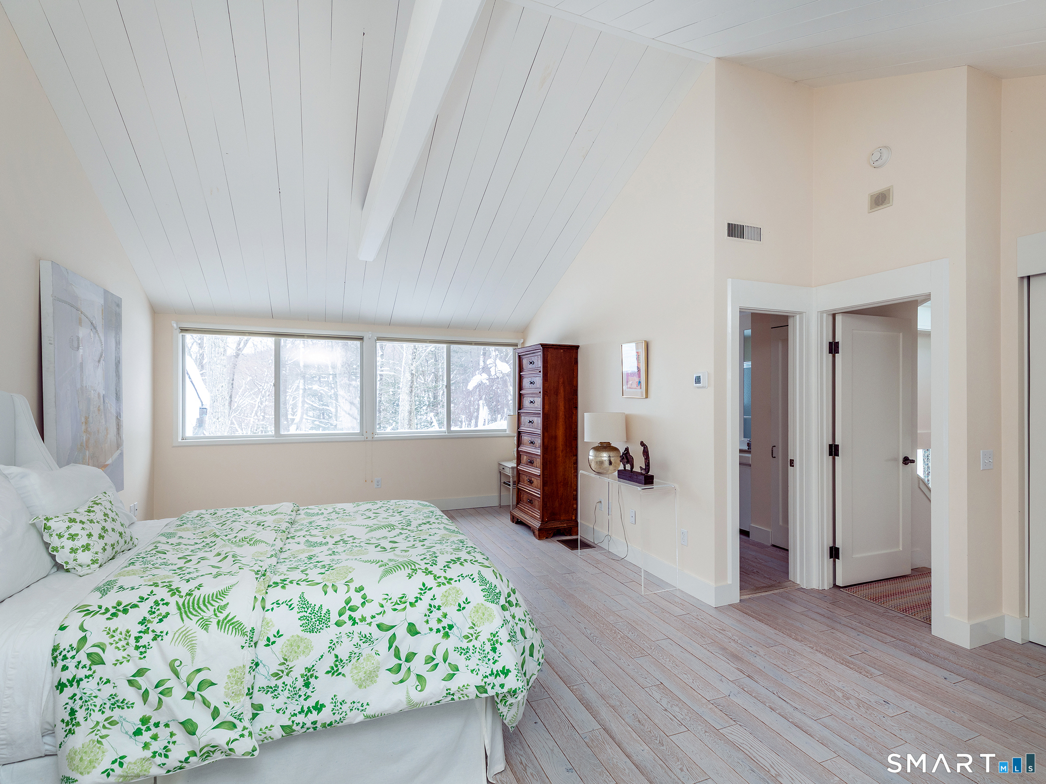 63 West Mountain Road Washington, CT 06793 - Photo 28 of 31 a bedroom with a large bed and wooden floor