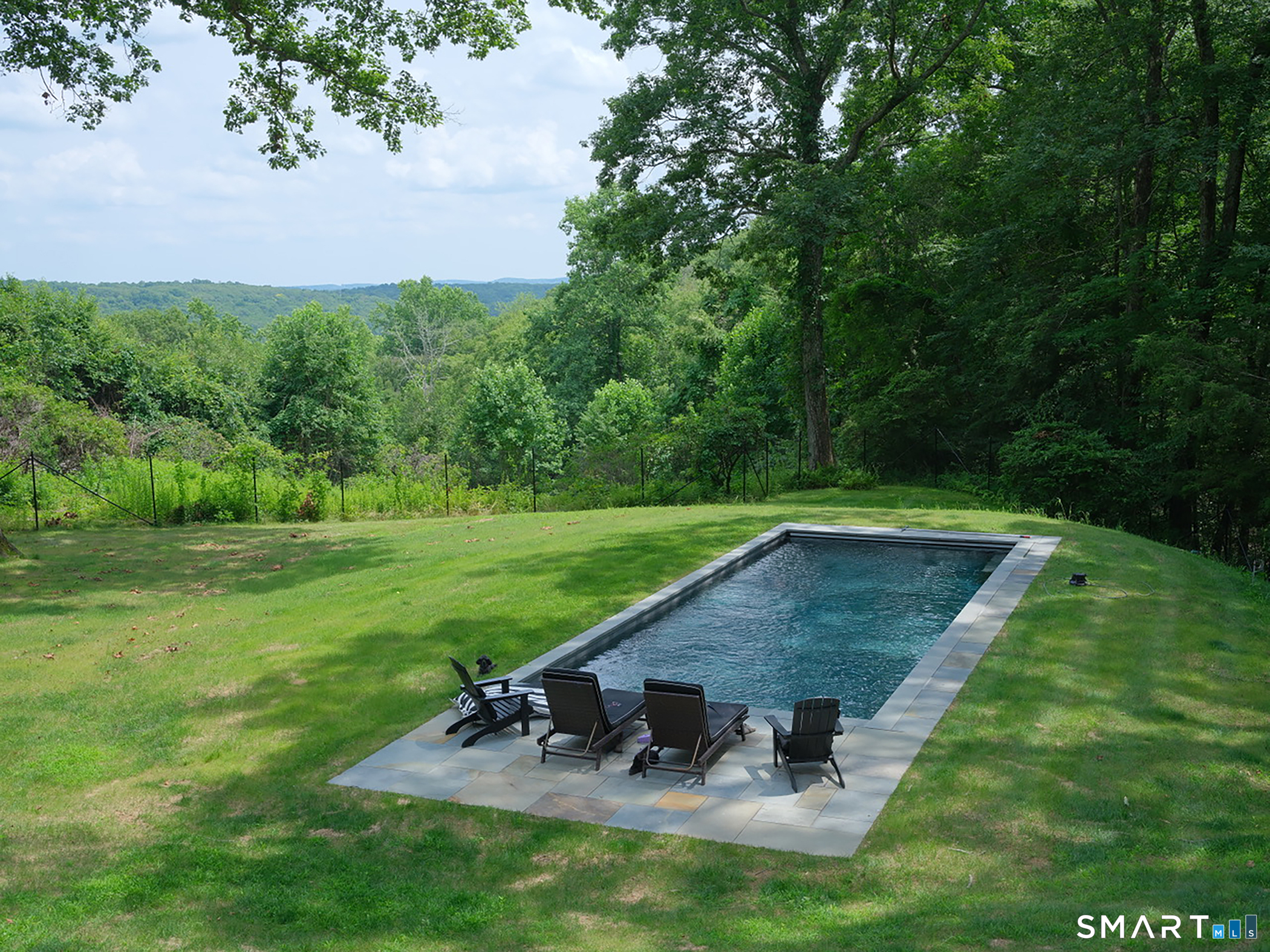 63 West Mountain Road Washington, CT 06793 - Photo 5 of 31 a view of a swimming pool with a yard