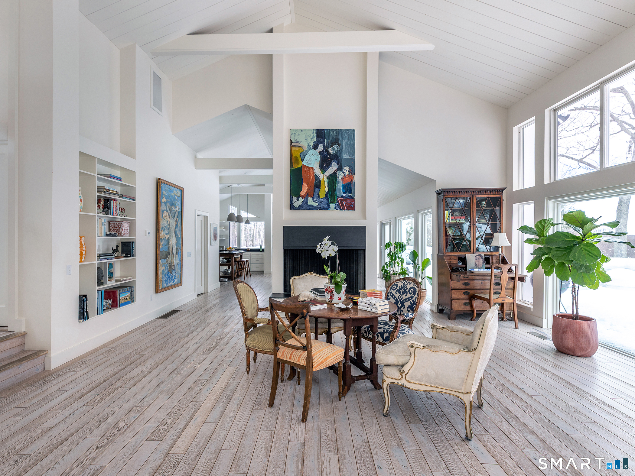 63 West Mountain Road Washington, CT 06793 - Photo 6 of 31 a view of a dining room with furniture wooden floor and a potted plant