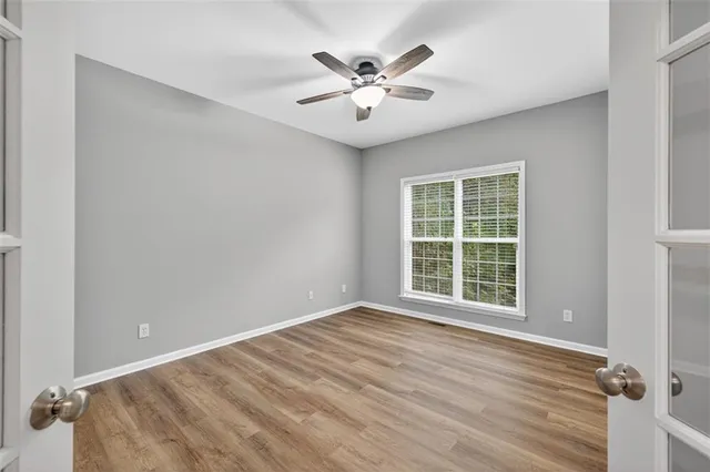 a kitchen with stainless steel appliances granite countertop wooden cabinets a stove a sink and dishwasher