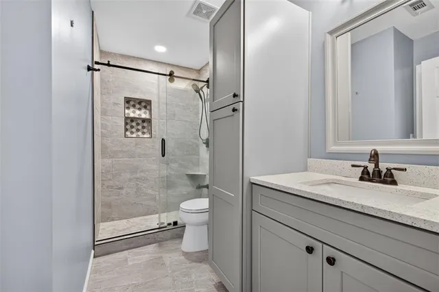 a view of a livingroom with a ceiling fan and window