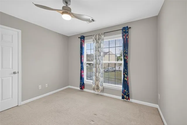 a bathroom with a shower and a sink