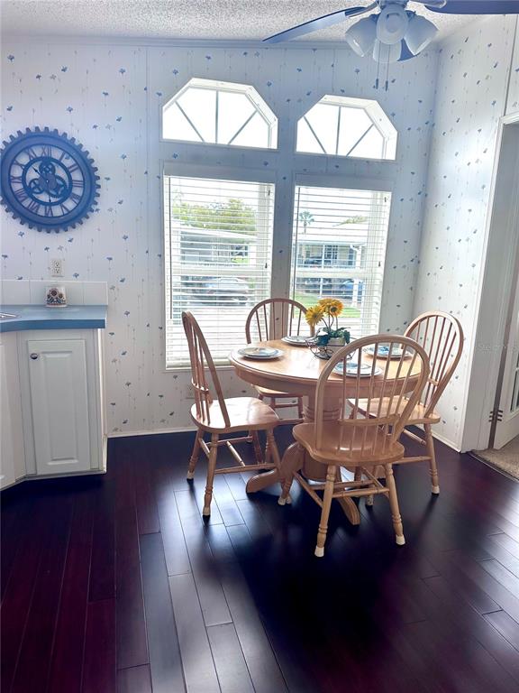 1100 South Belcher Road, Unit 406 Largo, FL 33771 - Photo 9 of 46 a dining room with furniture window and wooden floor