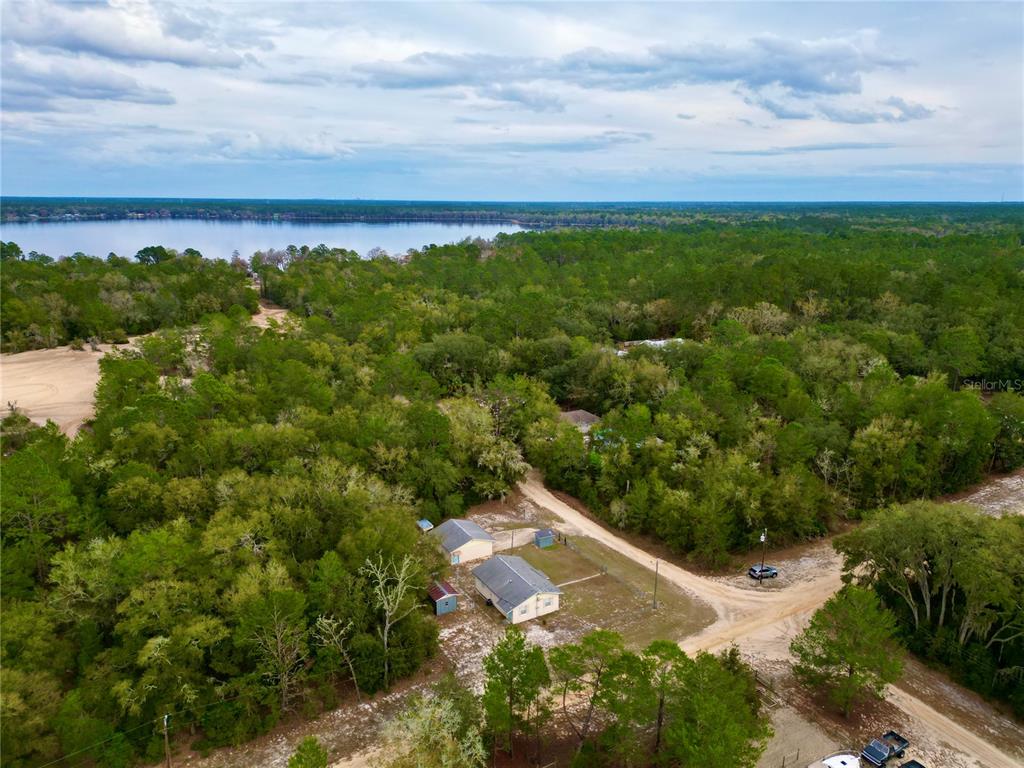 600 Wakulla Street Florahome, FL 32140 - Photo 3 of 47 an aerial view of residential houses with outdoor space and trees