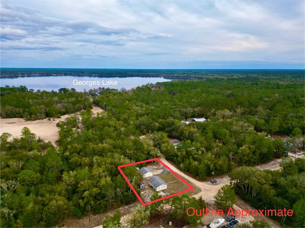 600 Wakulla Street Florahome, FL 32140 - Photo 41 of 47 an aerial view of a house with a yard