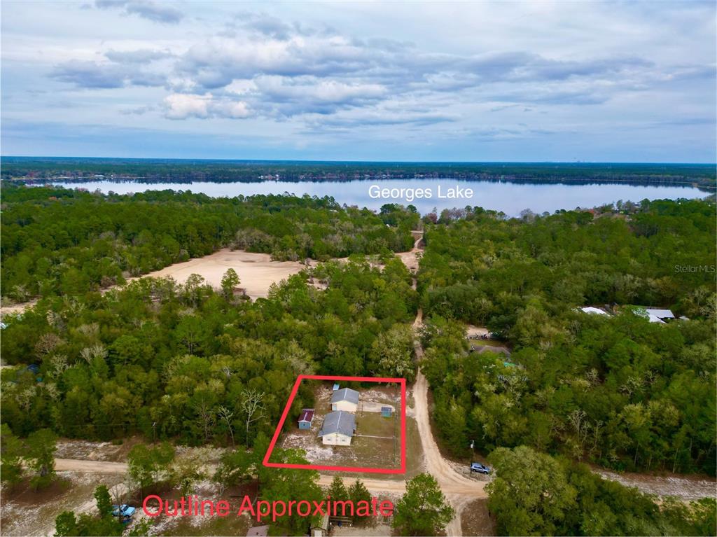 600 Wakulla Street Florahome, FL 32140 - Photo 5 of 47 a view of a city with lush green forest