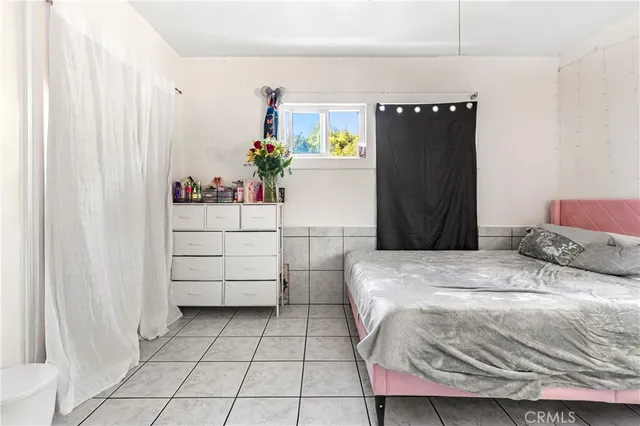 a bedroom with a bed and a cabinets