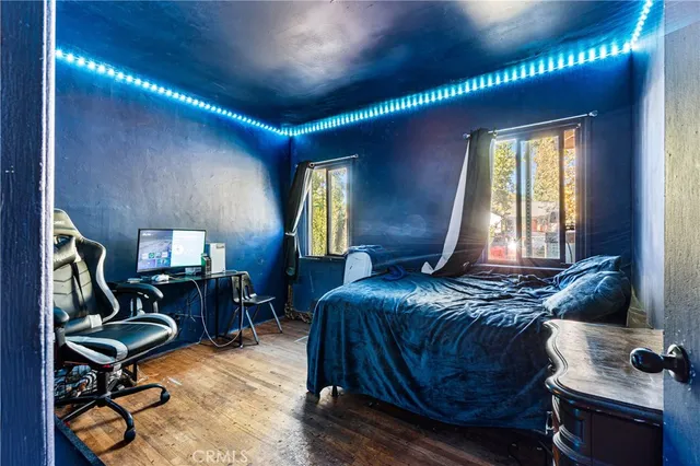 a bedroom with furniture and a window