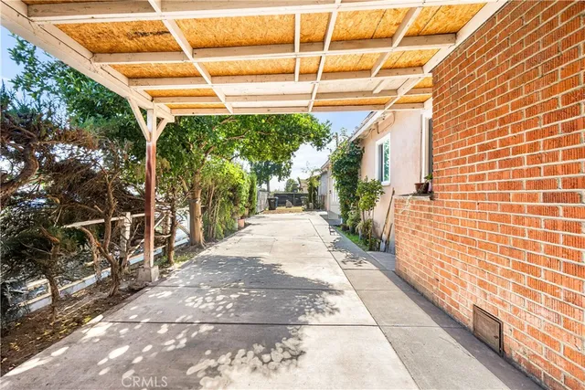 a view of a pathway with a door and a window